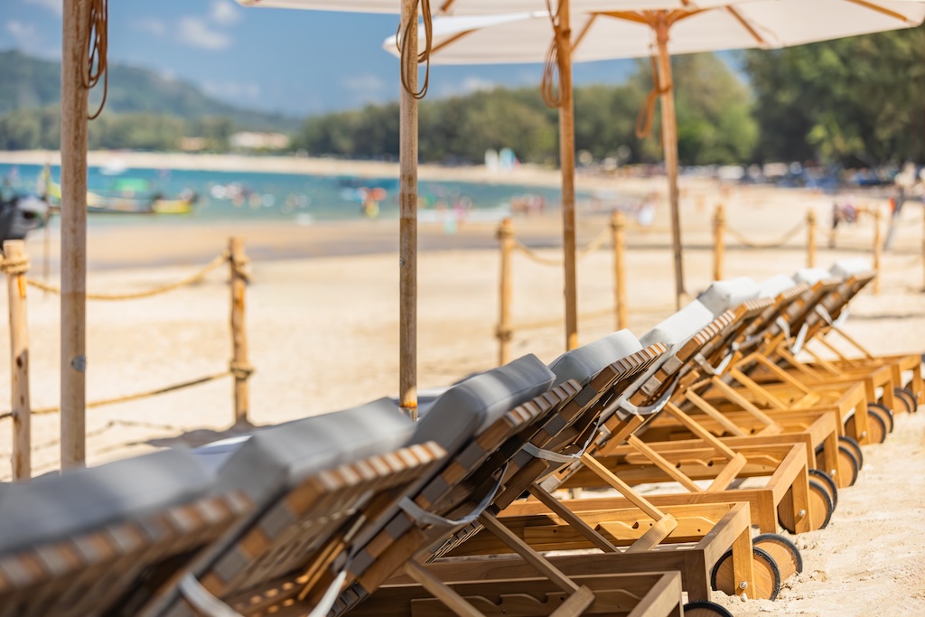 Bang Tao's sunbeds are multiplying, Kamala's gone Ibiza, and Natai's gone quiet-luxury. Here's where Phuket's beach club obsession is actually worth your baht.