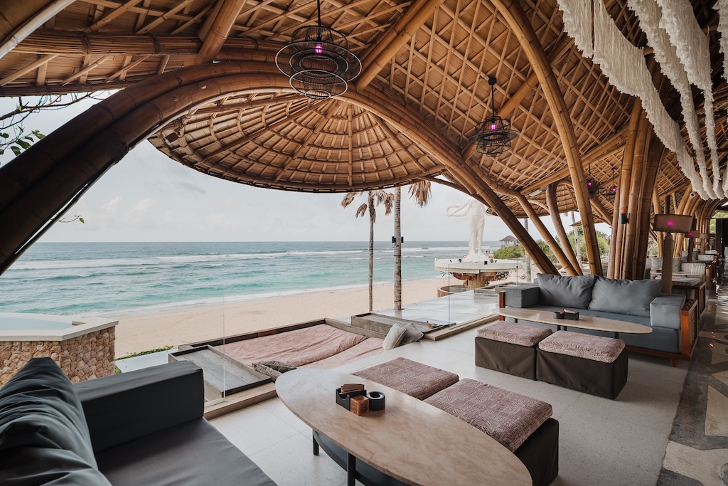 Bali didn't adopt the beach club, it perfected it. Here are the eleven clubs worth building a day around, from Seminyak sand to Uluwatu cliffs.