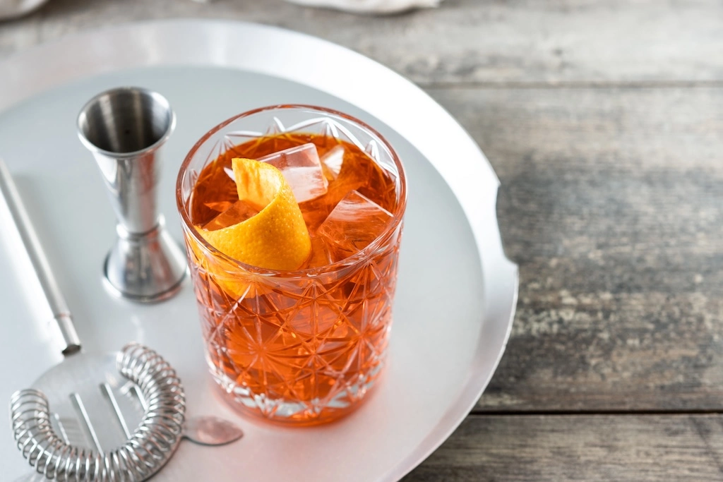 A Florentine count's stronger Americano became the world's favorite bitter classic. Here's the Negroni's history, its global revival, and Asia's finest pours, just in time for Negroni Week.