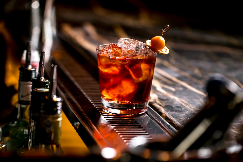 A Florentine count's stronger Americano became the world's favorite bitter classic. Here's the Negroni's history, its global revival, and Asia's finest pours, just in time for Negroni Week.